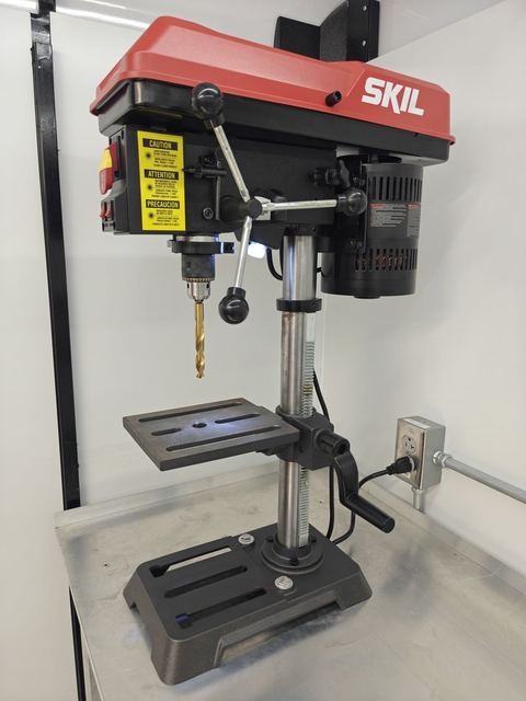 SKIL benchtop drill press on an aluminum bench (comes with Tooled)