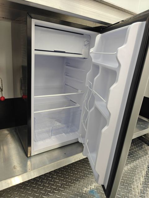 Mini fridge under the workbench